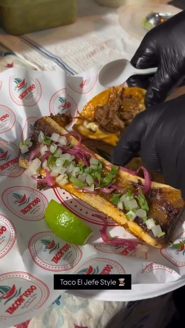 Close-up of authentic birria tacos with rich consomé