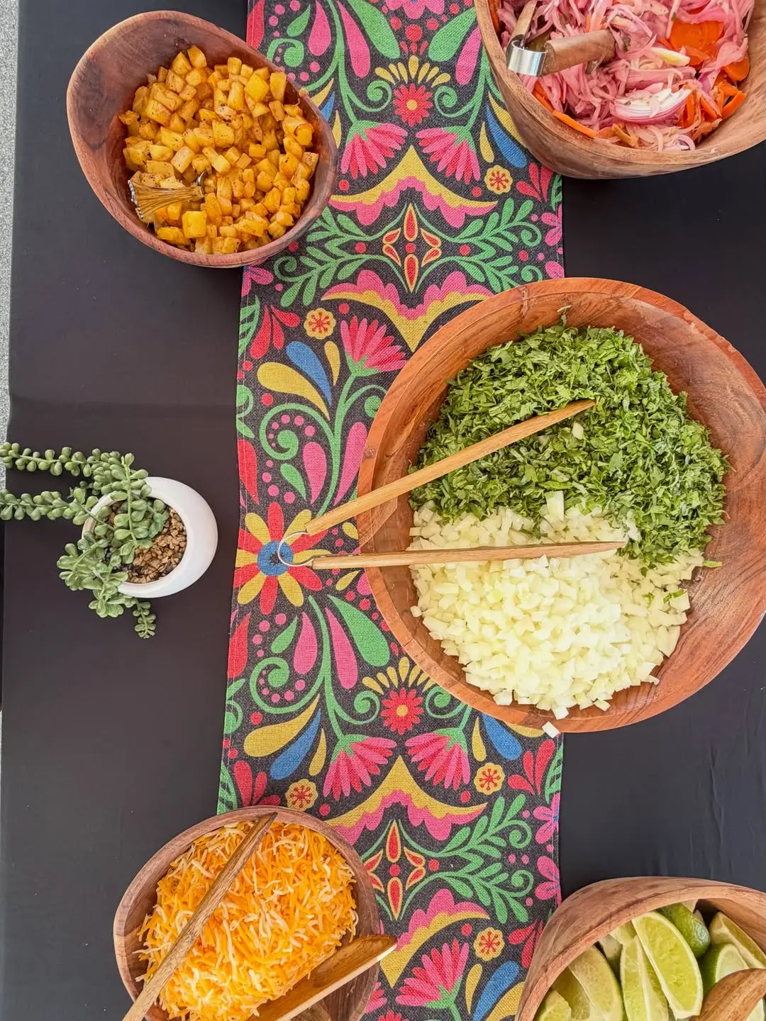 Colorful garnish bar with fresh salsas, limes, and toppings