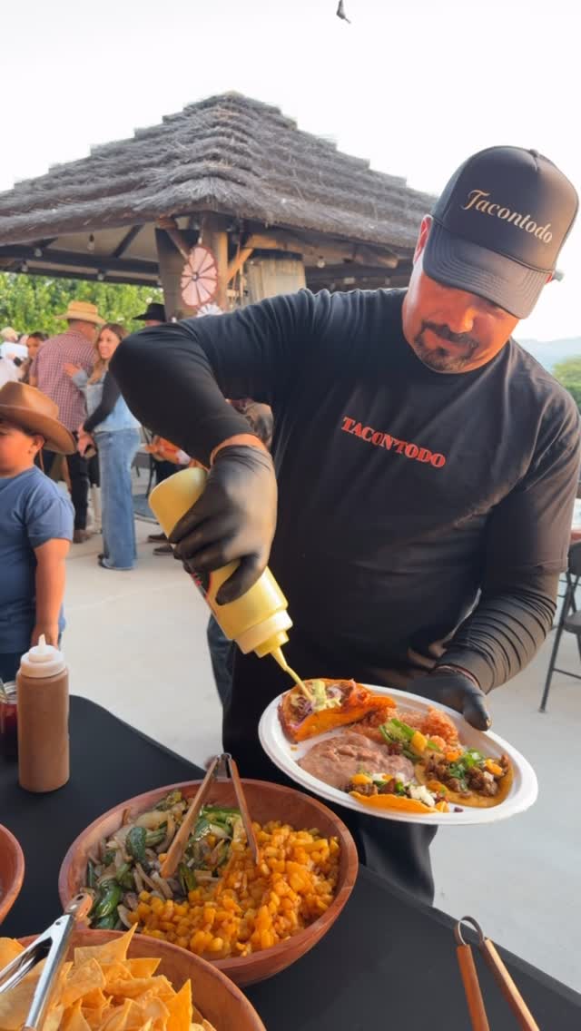 TacoNTodo chef serving guests at an event